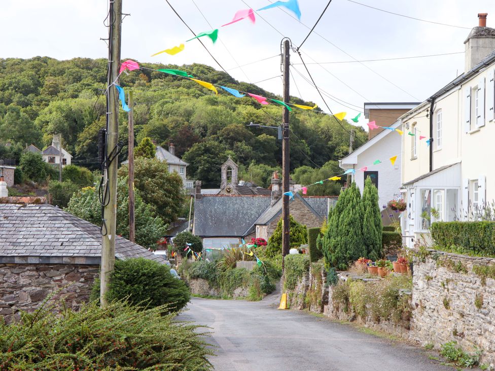 A street with houses and decorations at The Porthole in Newton Ferrers