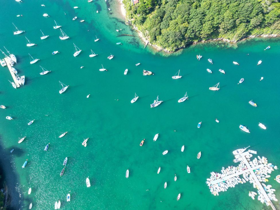 An aerial view of boats in a bay at The Porthole in Newton Ferrers