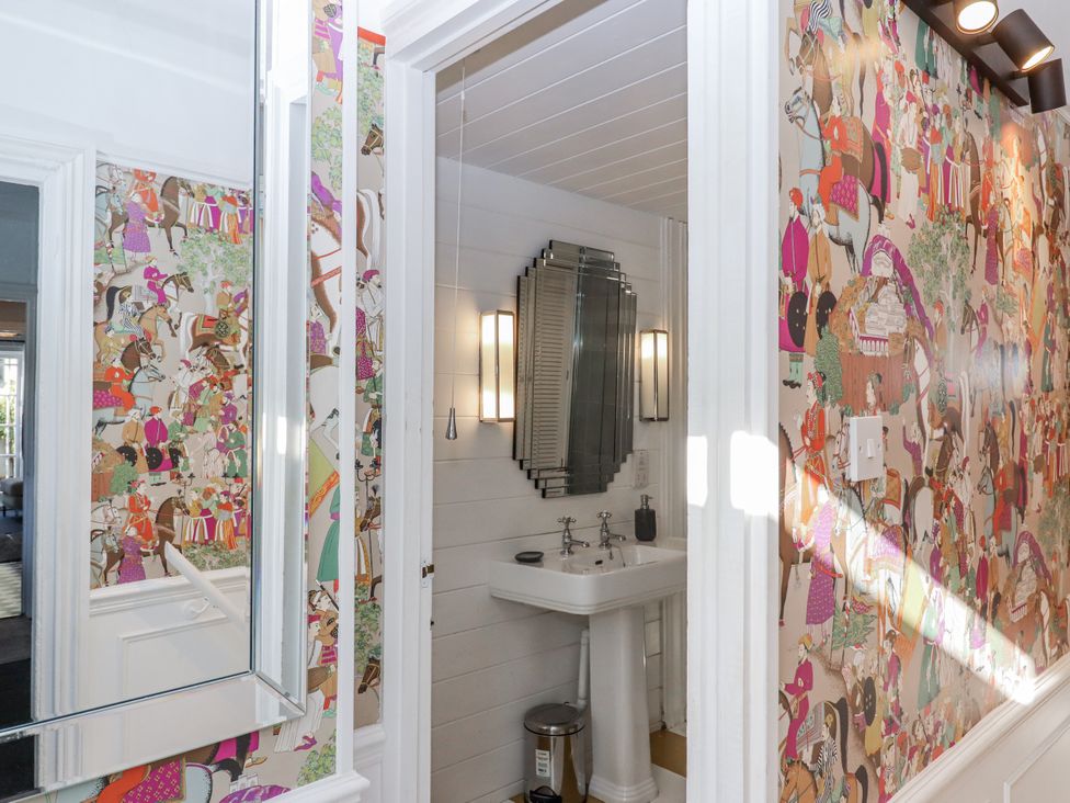 A bathroom with a sink and mirror at 26 Above Town in Dartmouth