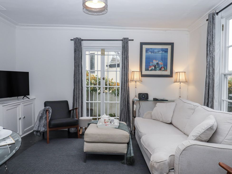 A living room with a sofa and television at 26 Above Town in Dartmouth