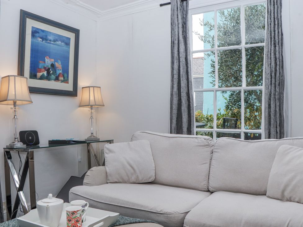 A living room with a sofa and a table at 26 Above Town in Dartmouth