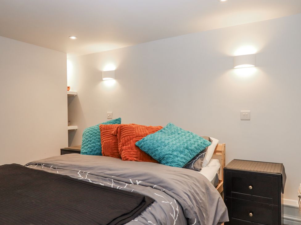 A bedroom with a bed and pillows at 26 Above Town, Dartmouth