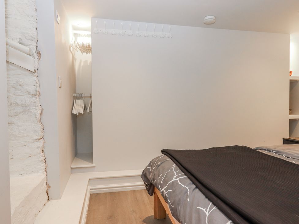 A bedroom with a bed and a closet at 26 Above Town Dartmouth