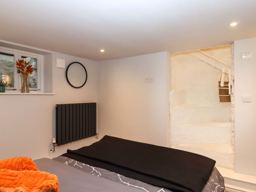 A bedroom with a bed and window at 26 Above Town Dartmouth