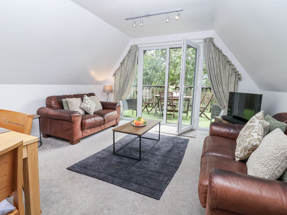 A living room with sofas and a coffee table at Valley Lodge 20 in Callington