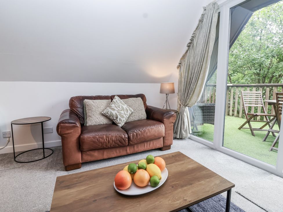 A living room with a sofa and a coffee table at Valley Lodge 20 Callington