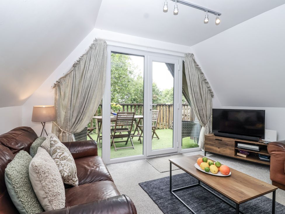 A living room with a sofa and coffee table at Valley Lodge 20 Callington