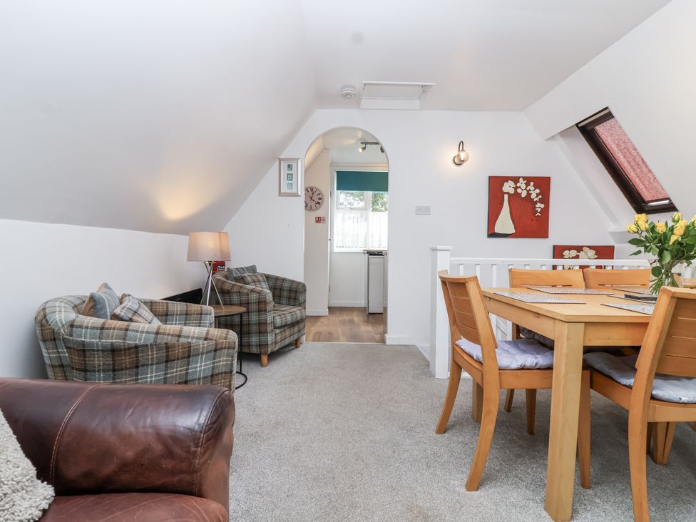 A living room with sofas and a dining table at Valley Lodge 20 Callington