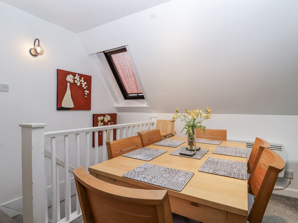 A dining room with a table and chairs at Valley Lodge 20, Callington
