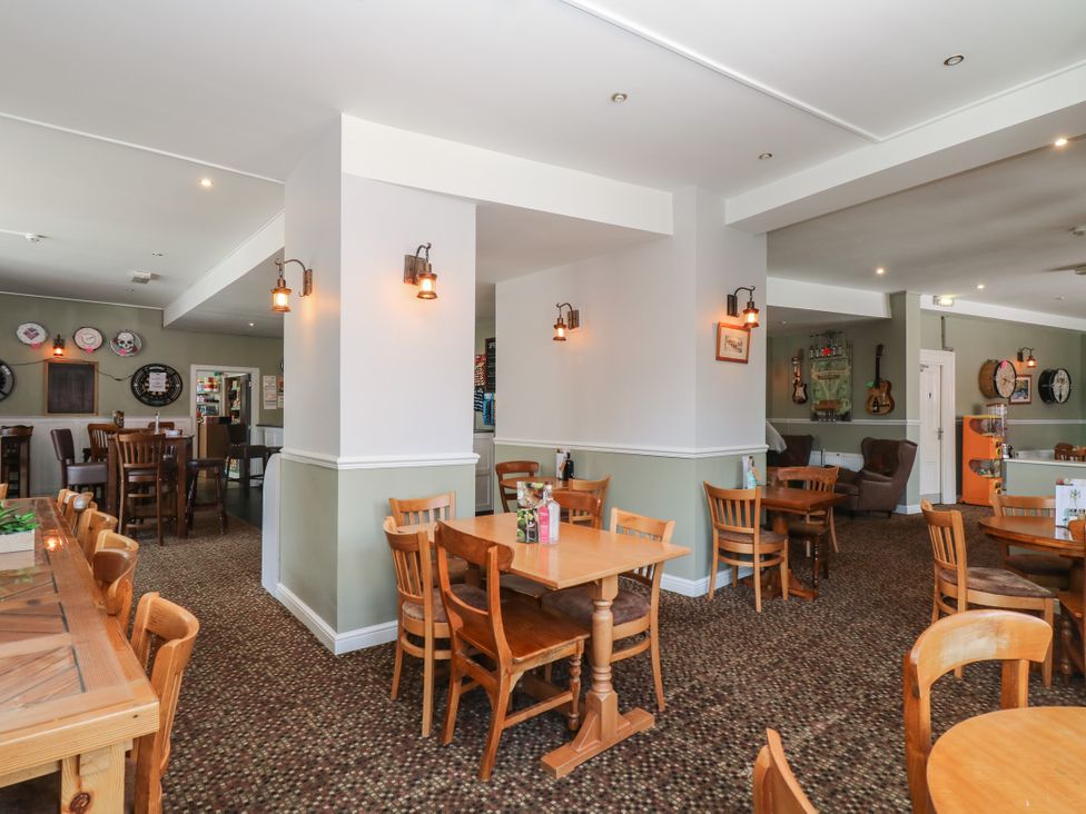A dining room with tables and chairs at Valley Lodge 20 in Callington
