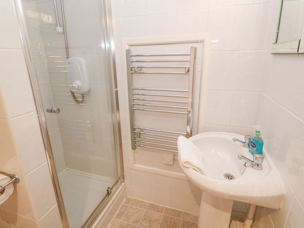 A bathroom with a shower and sink at Mill House Barn