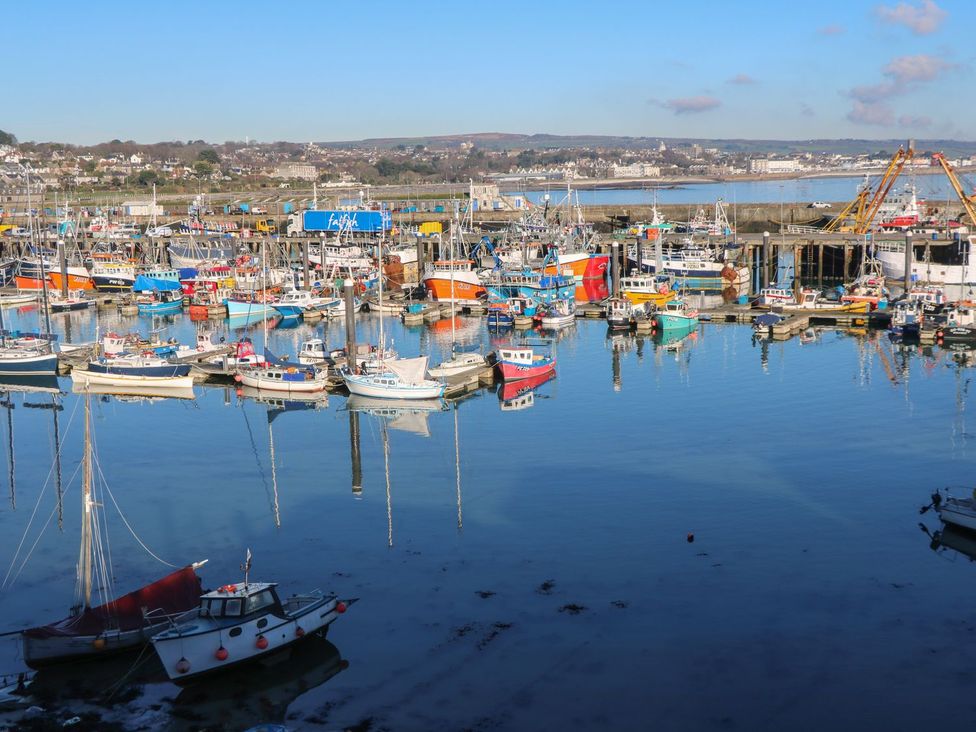 A harbor with various fishing boats at Mill House Barn 