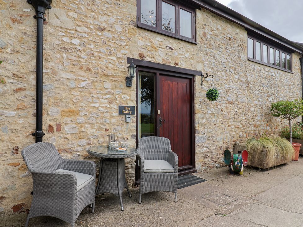 An outdoor area with chairs and a table at The Dairy