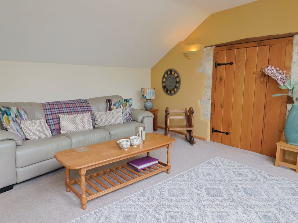 A living room with a sofa and coffee table at The Dairy in 