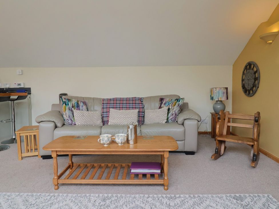A living room with a sofa and coffee table at The Dairy in 