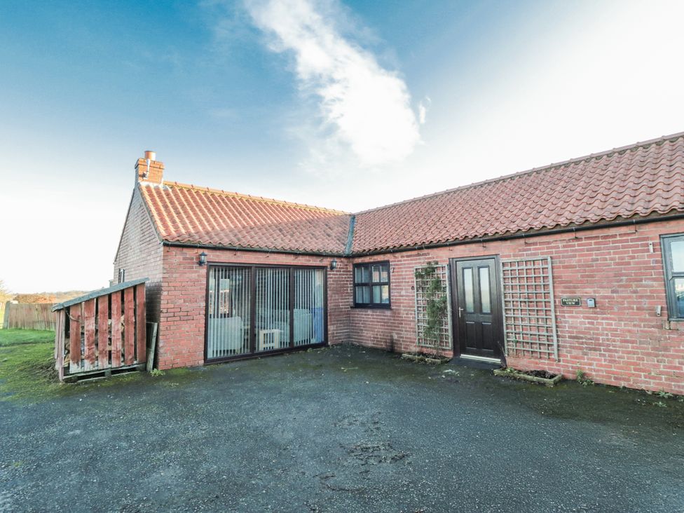 A house exterior with door and windows at Pasture View in 
