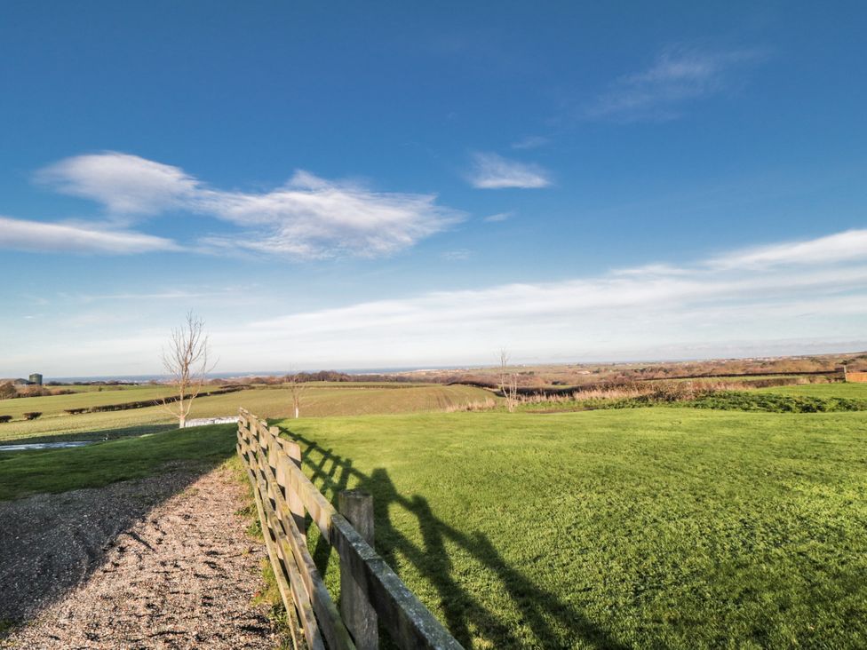 A view of grass and fence in a landscape at Pasture View