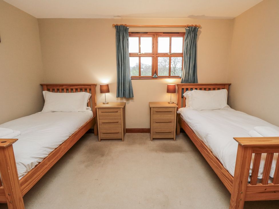 A bedroom with two beds and nightstands at Pasture View near Whitby