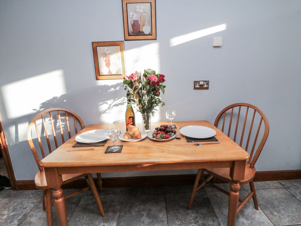 A dining room with a table set for two at Beck View in Whitby