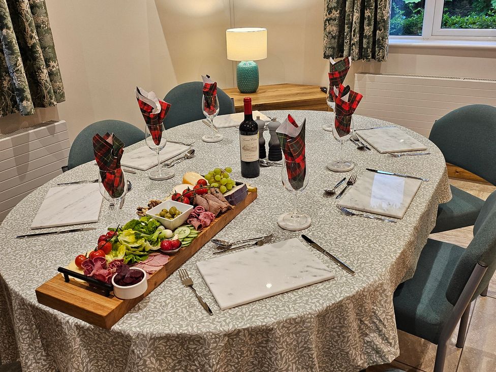 A dining table set with food and drinks at Rockhurst Farm Matlock