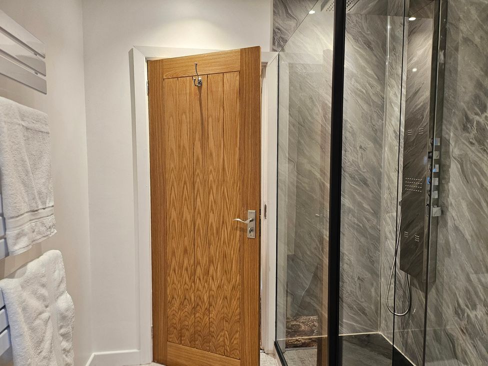 A bathroom featuring a shower and towels at Rockhurst Farm in Matlock