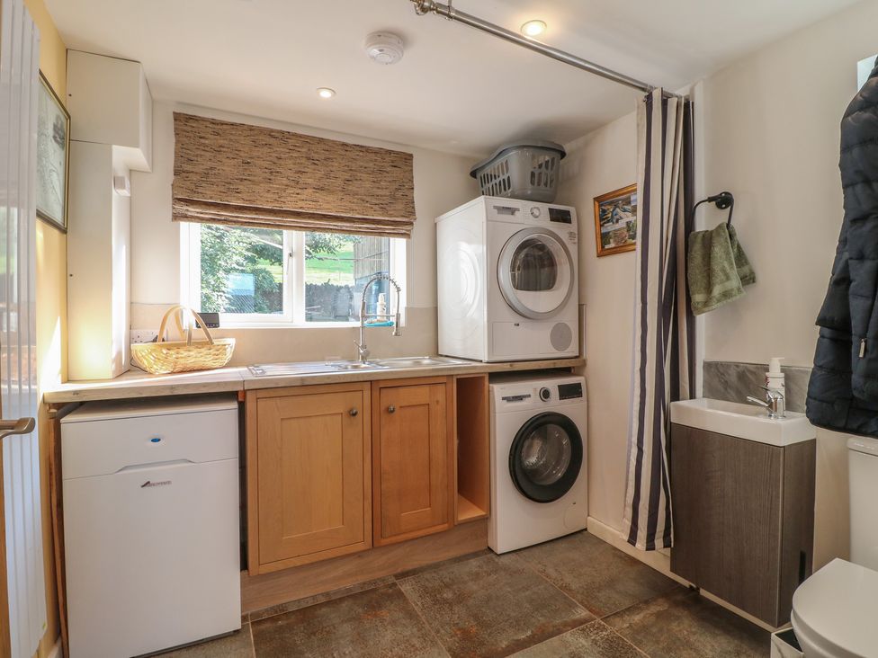 A laundry room with appliances at Rockhurst Farm near Winster