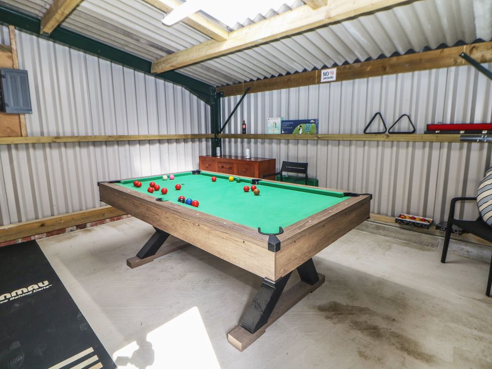 A games room with a pool table and snooker balls at Rockhurst Farm near Winster