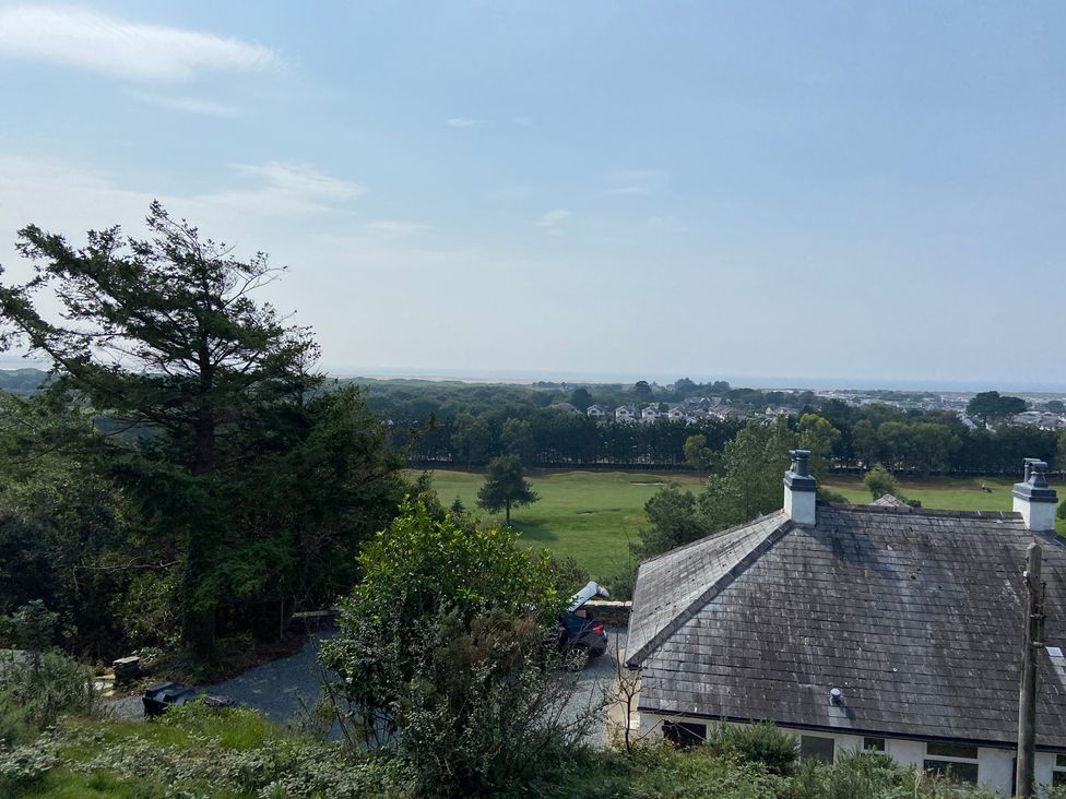 A view of a house and fields from a hill at Hafod Y Graig Morfa Bychan