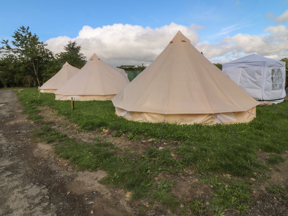 Bell tents on grass near a road at Bell Tent Three 