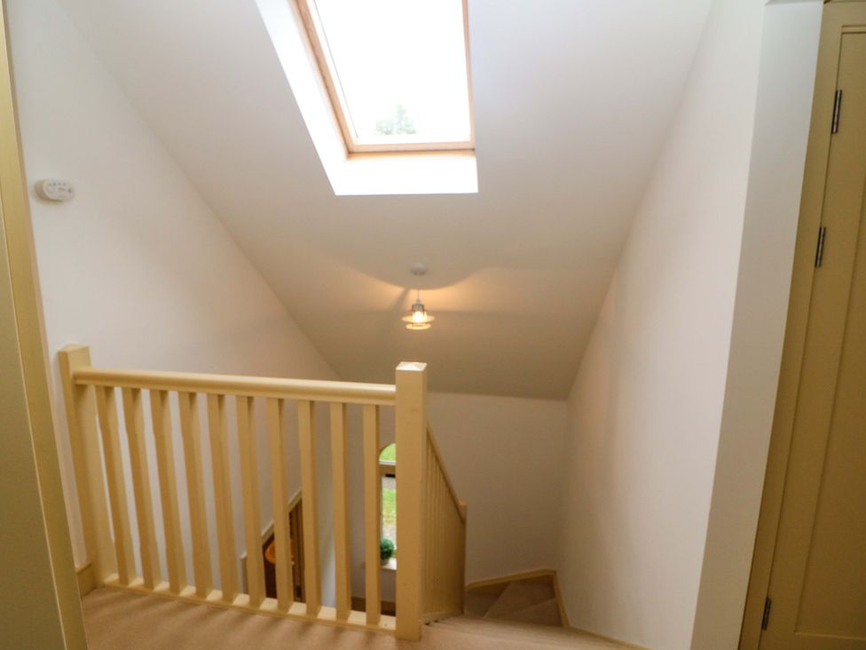 A staircase with a skylight at 25 Ring of Kerry Holiday Cottages in Kenmare