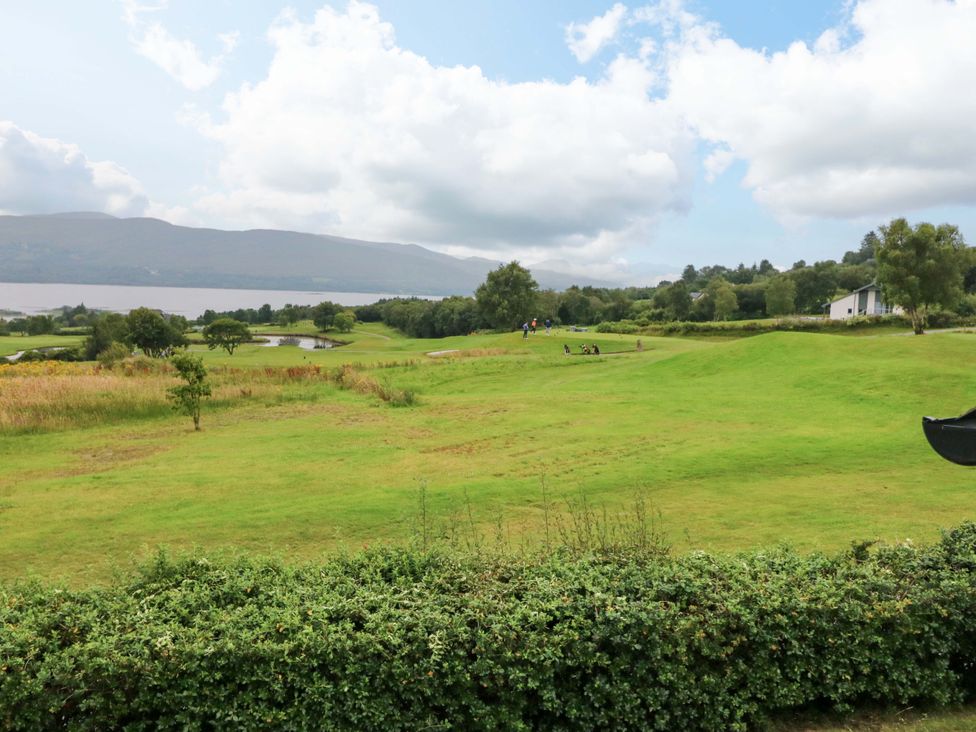 A landscape view with trees and a lake at 25 Ring of Kerry Holiday Cottages Kenmare