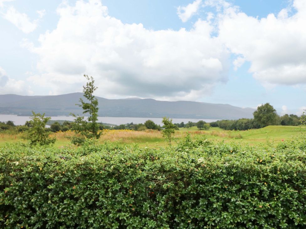 A view of a lake with mountains in the background at 25 Ring of Kerry Holiday Cottages in Kenmare