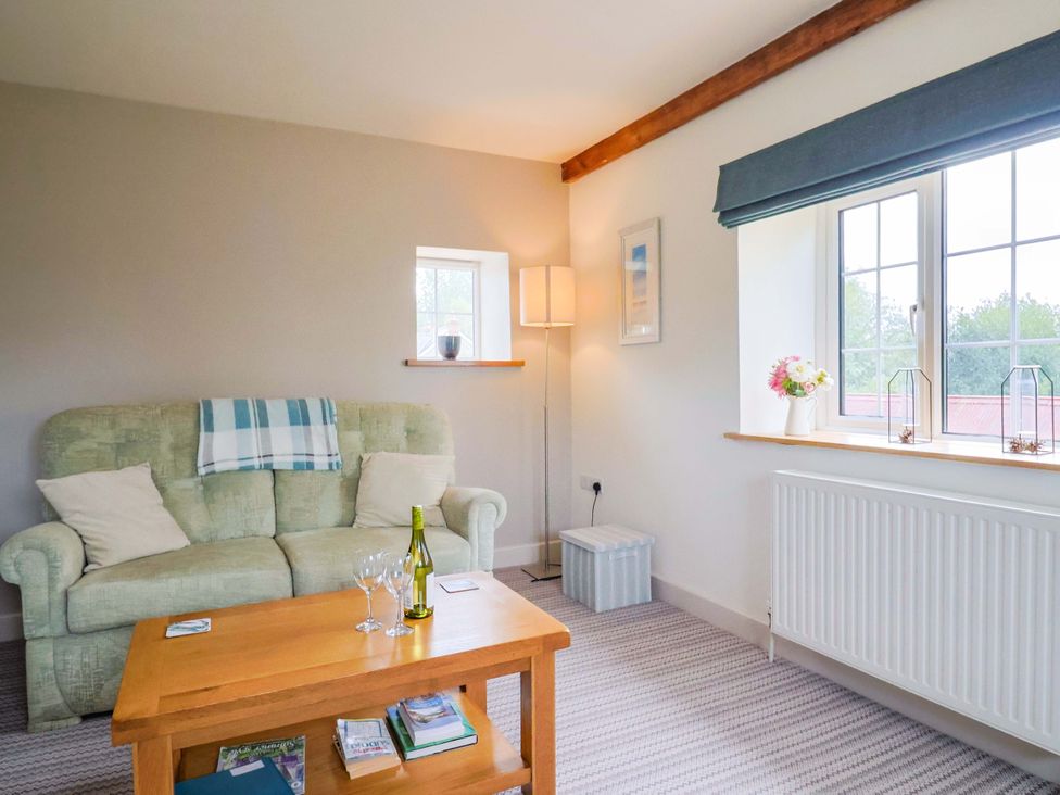 A living room with a sofa and coffee table at The Cottage Middle Westwater Westwater Nr Axminster
