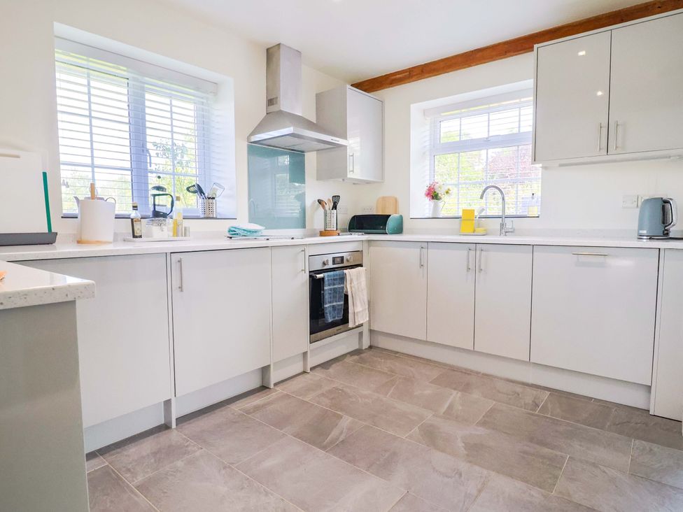 A kitchen with cabinets and a countertop at The Cottage Middle Westwater Westwater Nr Axminster