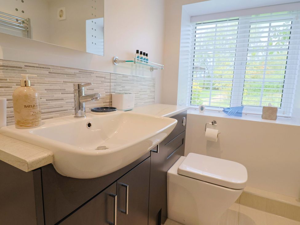 A bathroom with a sink and toilet at The Cottage Middle Westwater