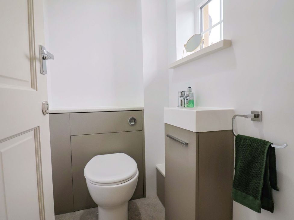 A bathroom with a toilet and sink at The Cottage Middle Westwater