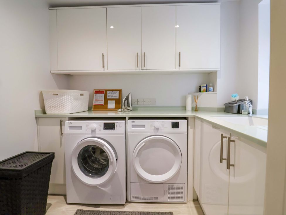 A laundry room with washing machine and dryer at The Cottage Middle Westwater Westwater Nr Axminster