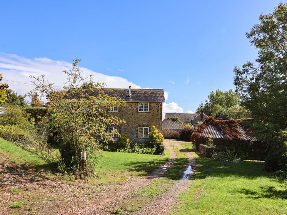 A house with a gravel driveway and garden at The Cottage Middle Westwater in Westwater Nr Axminster