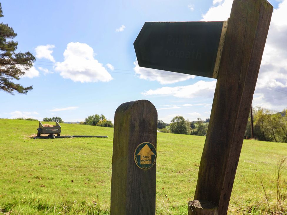 A signpost indicating public footpath in a field at The Cottage Middle Westwater Westwater Nr Axminster