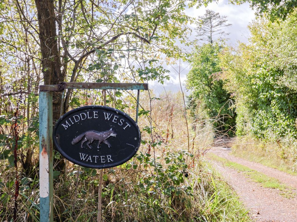 A sign for Middle West Water along a path in Westwater Nr Axminster