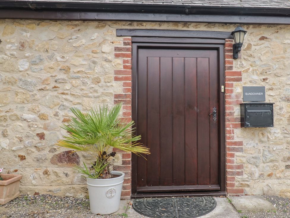 A door with a mailbox and a plant at The Sundowner in Wyke Nr. Axminster