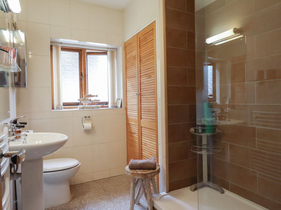 A bathroom with a toilet and basin at The Sundowner in Wyke Nr. Axminster