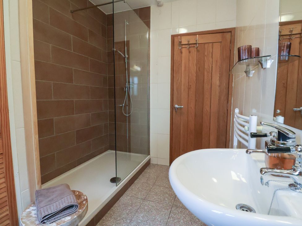 A bathroom with a shower and sink at The Sundowner in Wyke Nr. Axminster