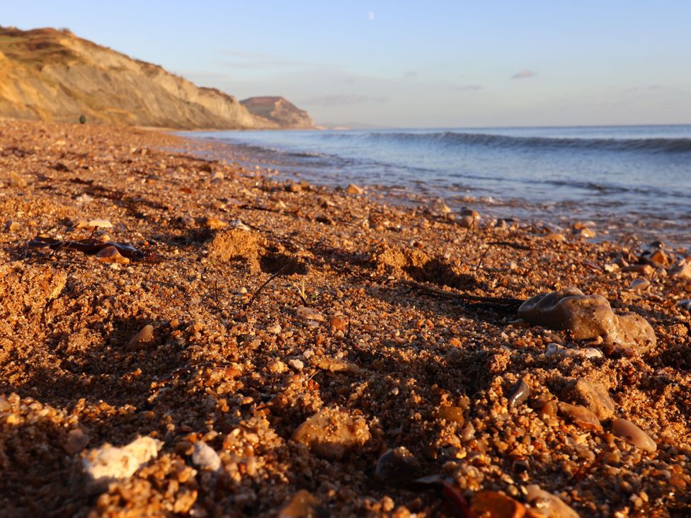 A beach with sand and pebbles in the foreground at The Sundowner in Wyke Nr. Axminster