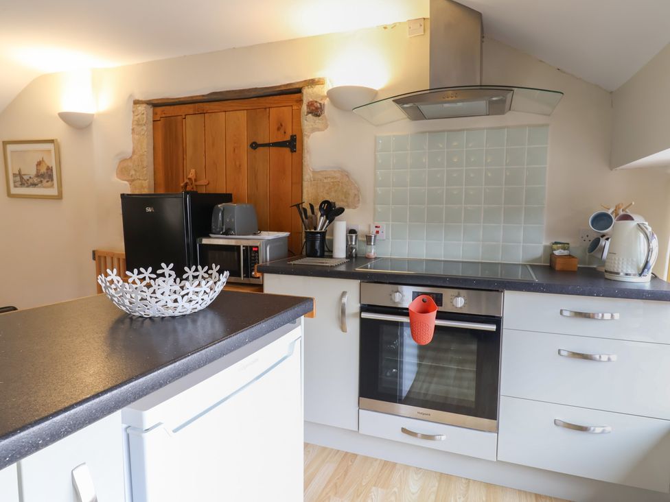 A kitchen with appliances and utensils at The Granary Wyke Nr Axminster