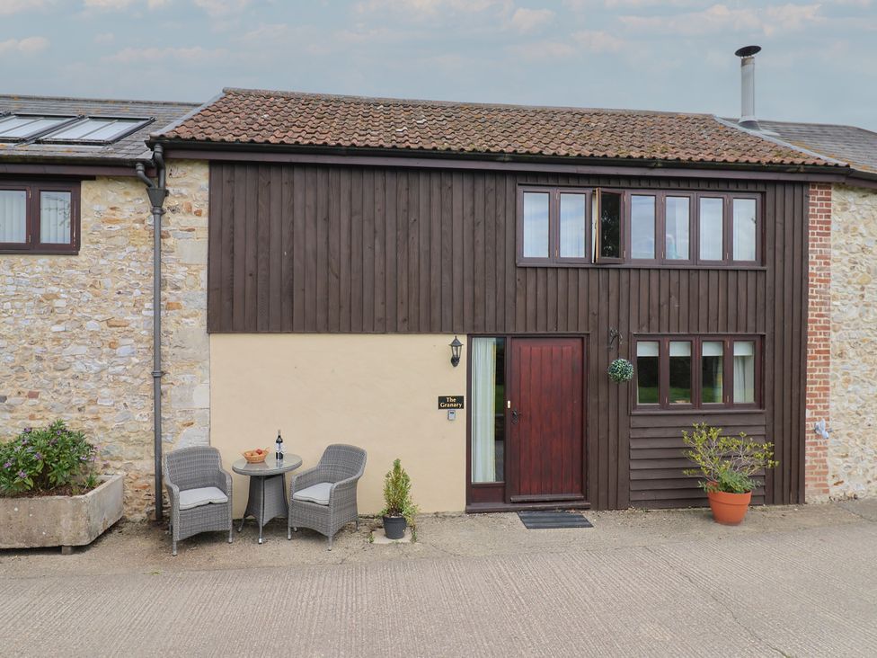 An outdoor area with seating and plants at The Granary in Wyke Nr Axminster