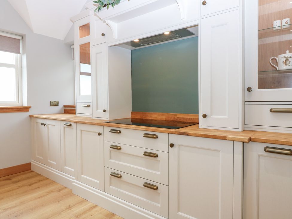 A kitchen with cabinets and a countertop at The Old Kipper Hoose in Banff