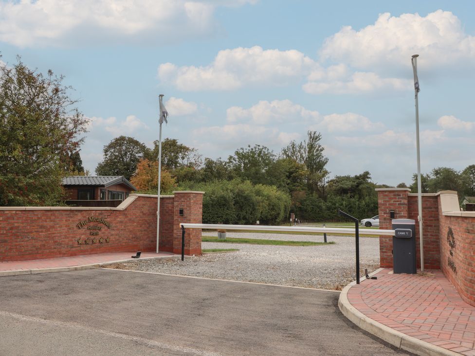 An entrance with a sign and gate at The Meadows Park 1 in Great Hatfield near Hornsea