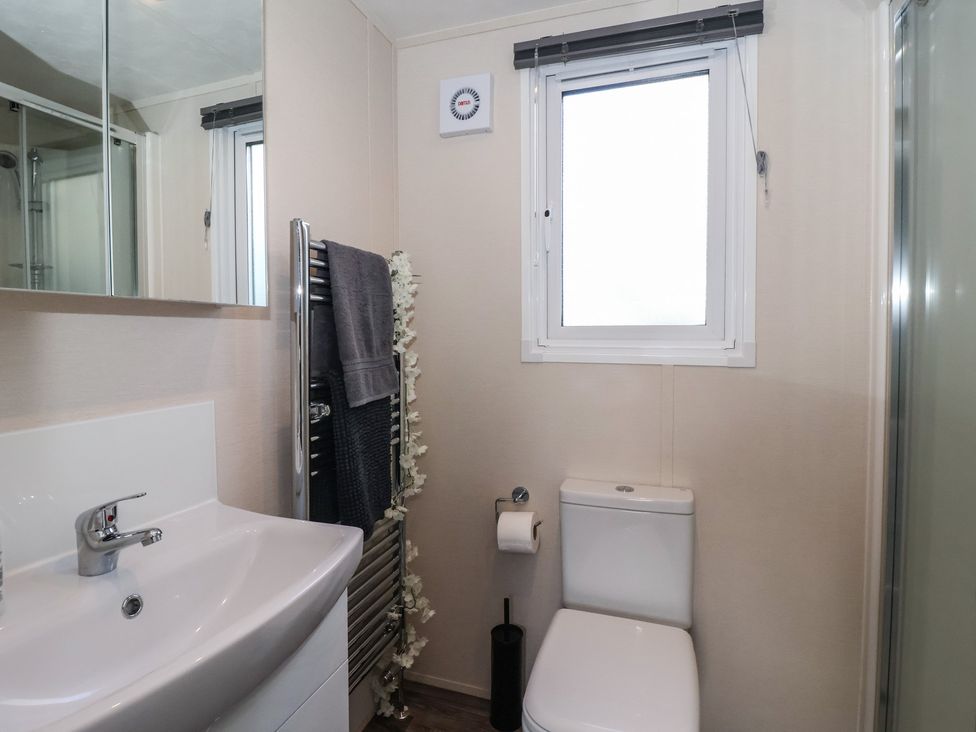 A bathroom with sink and toilet at Meadows Park 1 Great Hatfield near Hornsea