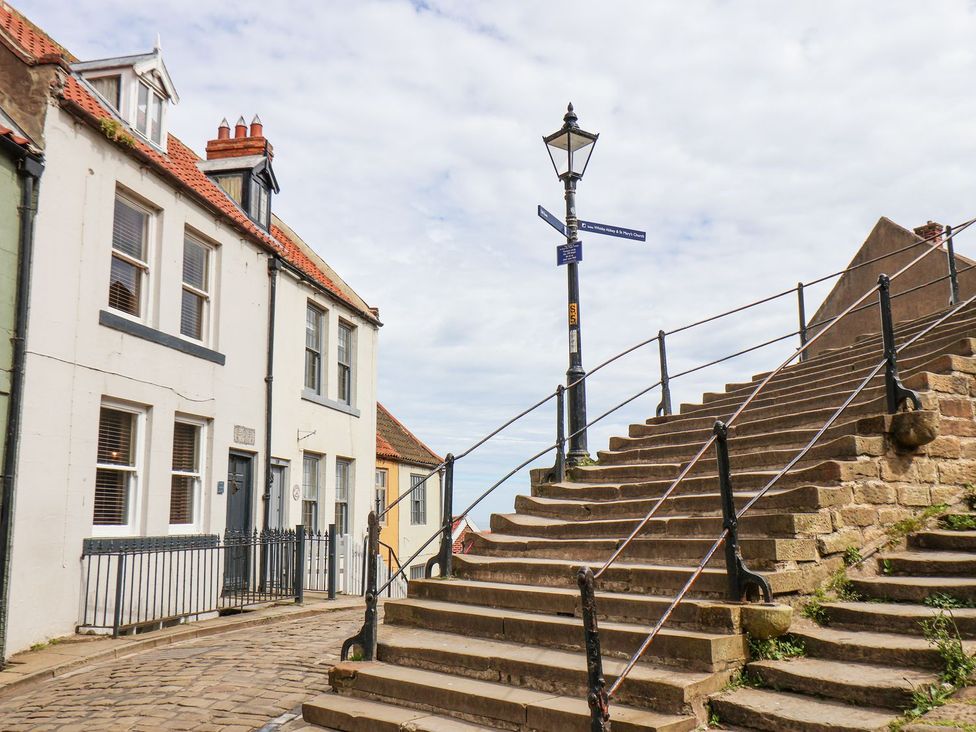 A staircase and houses in a street at Greenfingers in Whitby